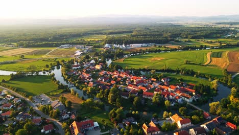 stunning aerial 4k drone footage of kostanjevica na krki in the golden sunset light