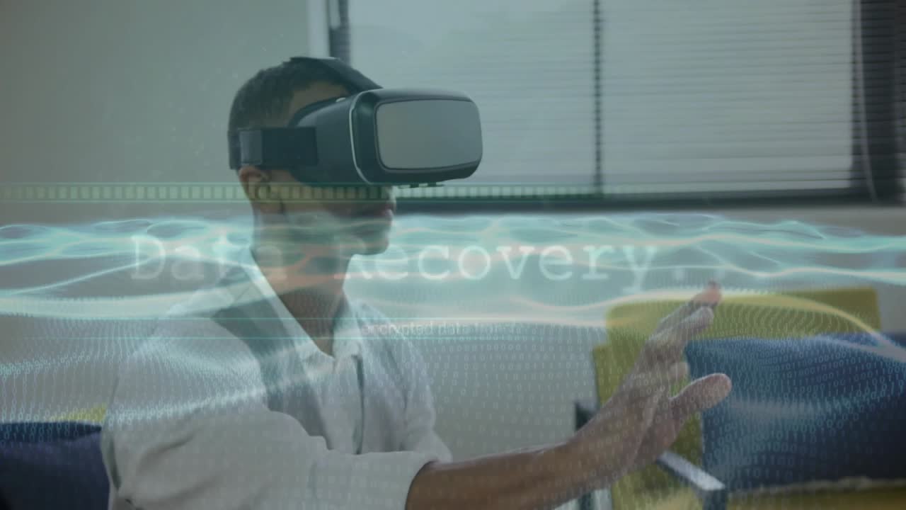 Man wearing VR headset pointing and selecting rotating interface waves for data recovery in lounge