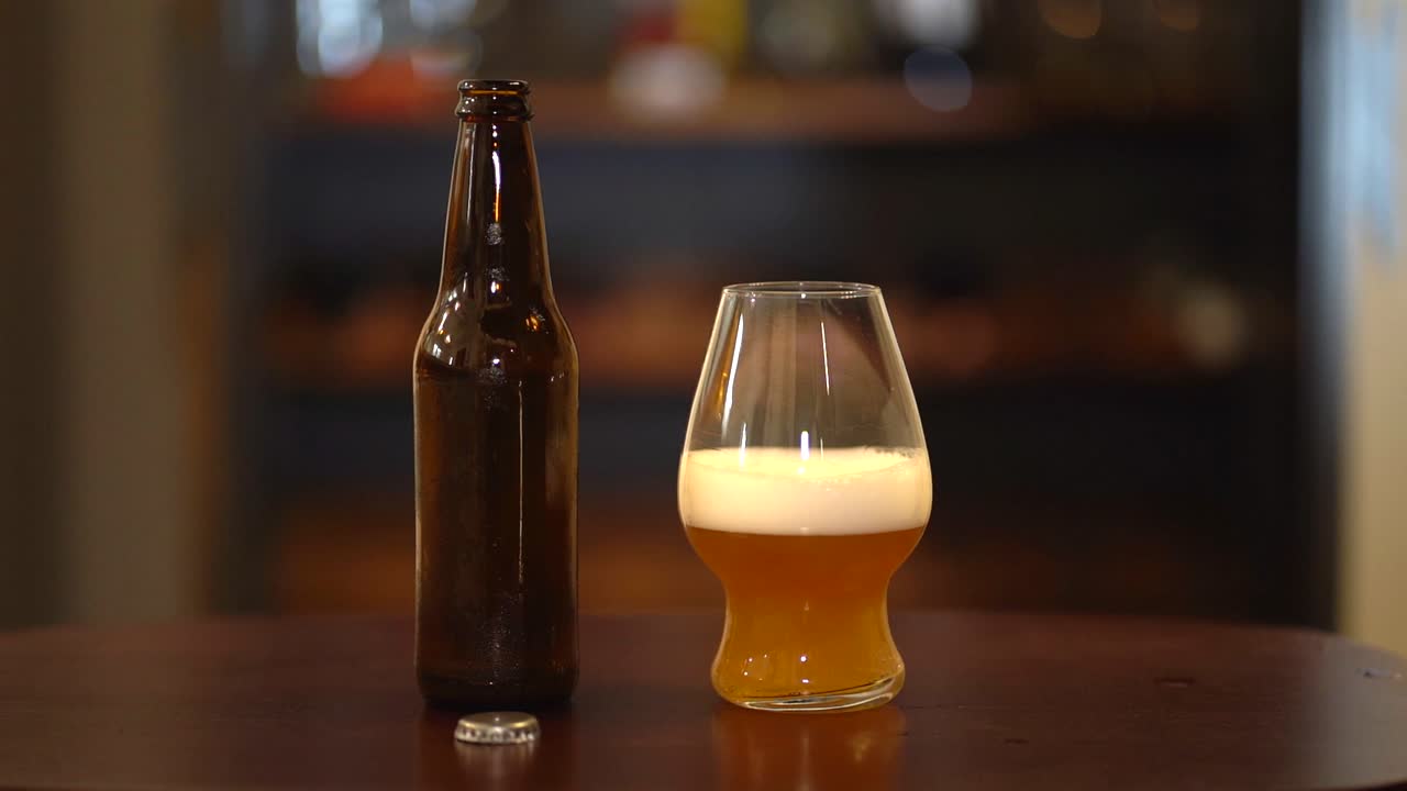 latin placing glass of beer in table