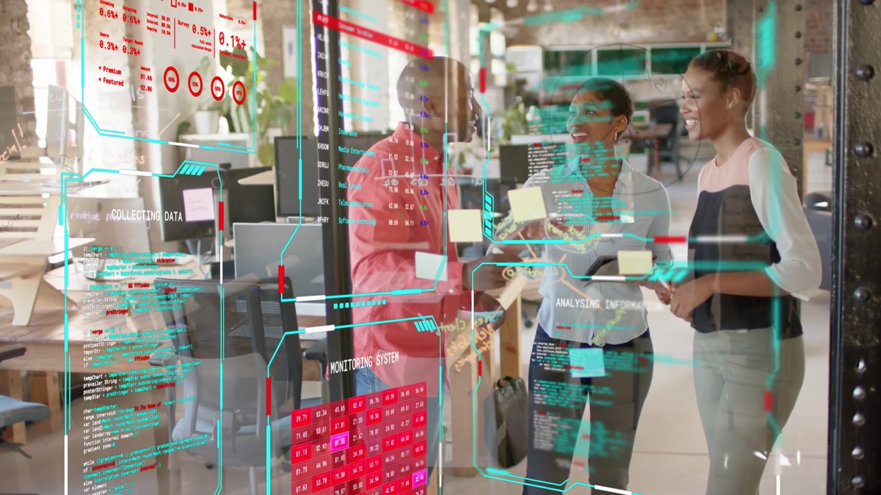 Tech team leaning at glass display man pointing and woman tapping HUD changing marking sticky notes