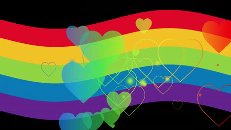 animación de corazones de arco iris sobre arco iris en fondo negro.