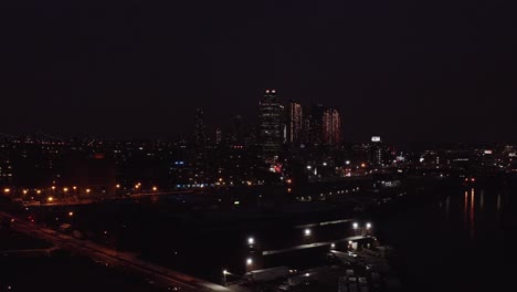 Drone-footage-counterclockwise-sweep-of-Manhattan-East-River-evening-skyline-as-seen-from-Brooklyn-and-Queens-in-4K