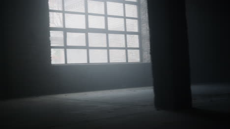 energetic man running fast in loft building. male runner jogging in sports club