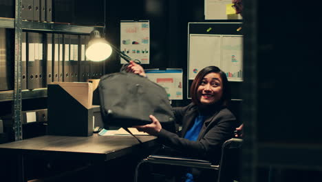 detective with impairment studying classified folders in archive room