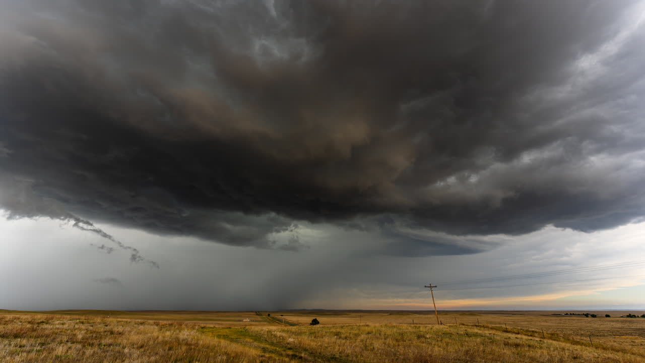Grasslands and dark storm clouds time lapse