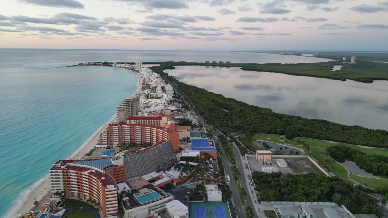 Stunning aerial view of Cancun's coastline, clear turquoise water and resorts, playa delfines