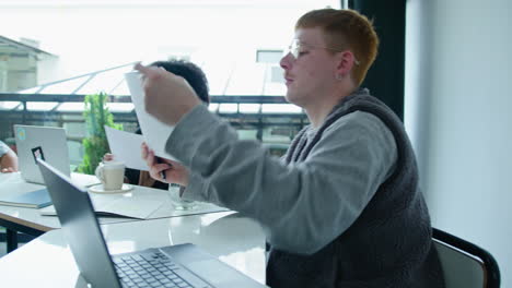 Young Colleagues Discussing Papers on Business Meeting