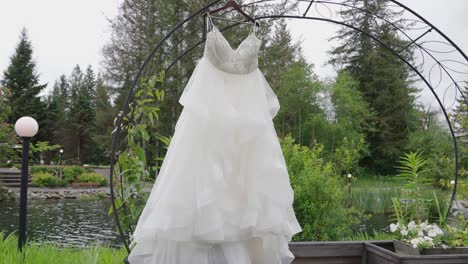 beautiful white wedding dress hanging