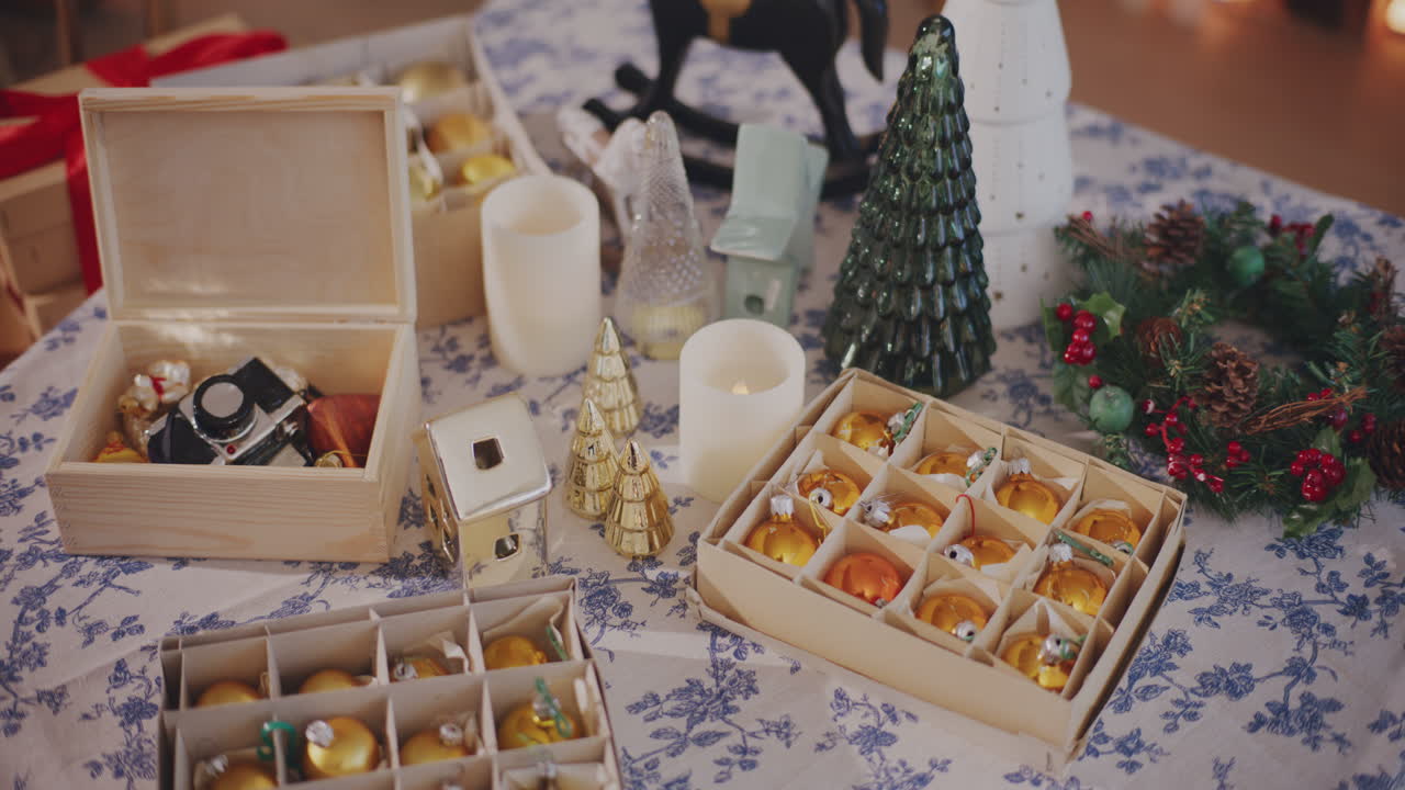 Baubles, Xmas tree and lighting equipment on table