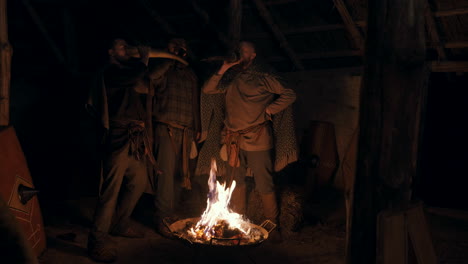 vikings around a campfire at night