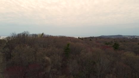 Drone-moving-downward-from-showing-the-lake-to-examine-the-dunes