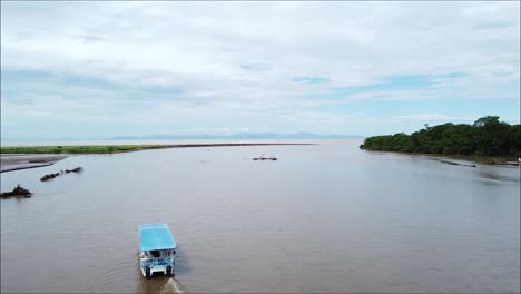 Boat-In-Tropical-River,-Tarcoles-Costa-Rica,-Puntarenas,-Mangrove,-Tree