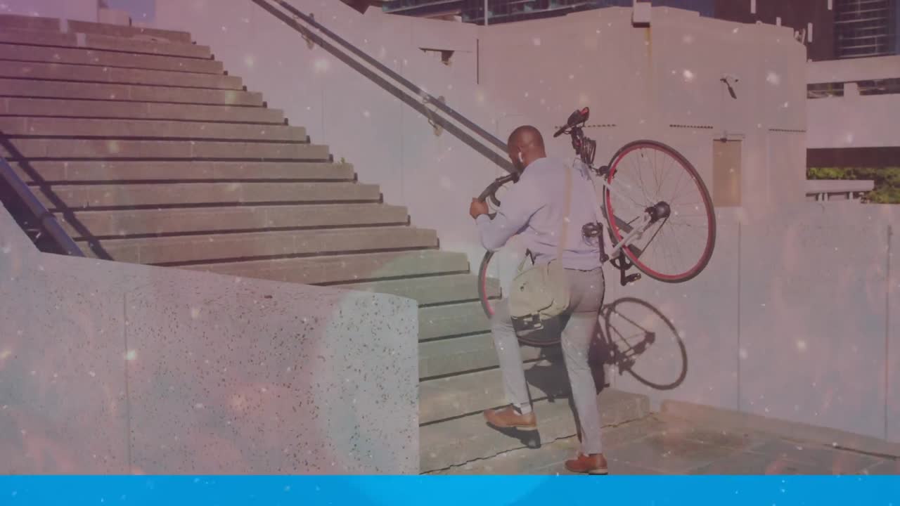 animación de formas que se mueven sobre un hombre afroamericano que lleva una bicicleta