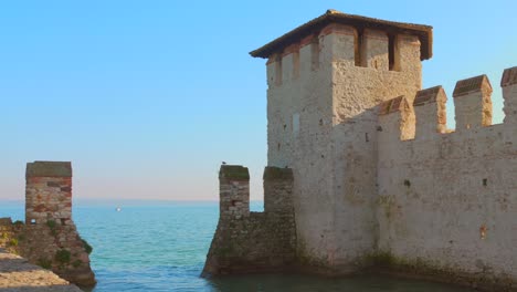 pan shot of large wall inside the ocean of sirmione castle, italy.