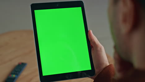 manager hand holding mockup tablet office closeup. man reading chroma computer
