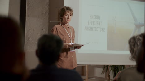 young female engineer giving presentation on energy efficient architecture