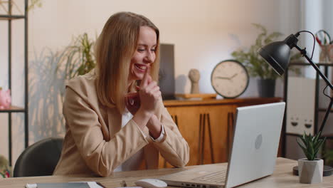 Sneaky cunning young businesswoman scheming evil plan thinking over devious villain idea at office