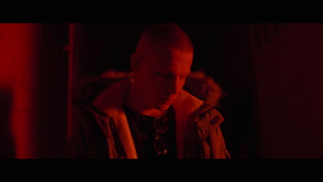 person in red light interior