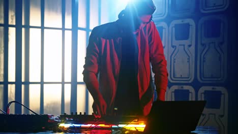 man using audio mixing console