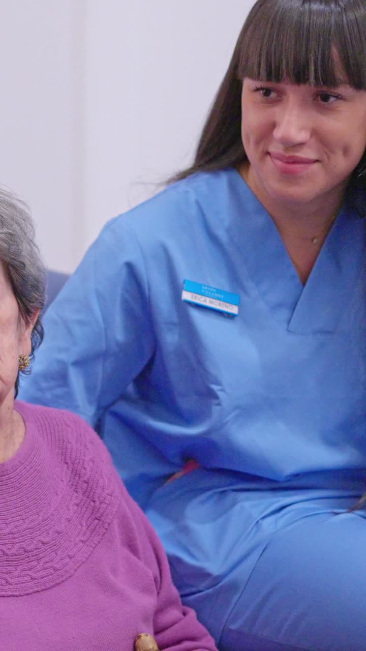Caregiver Comforting Elderly Woman with Gentle Touch