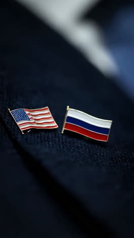 us and russia flag pins on fabric