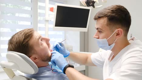 dentist examining patient's teeth