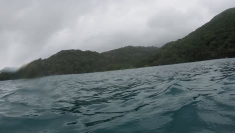 pov shot of con dao island in vietnam, captured using a gopro from a water surface
