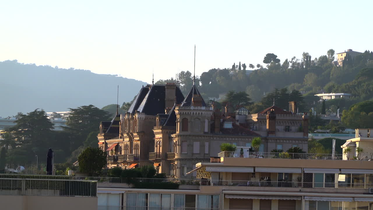 Cannes, France - March 19, 2025: Distant view of Chateau Vallombrosa castle surrounded by greenery