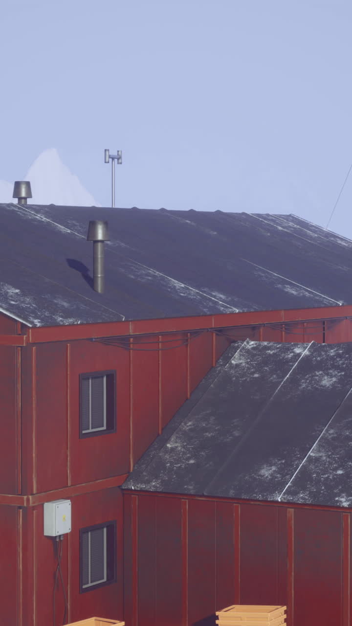 Research station located in a snowy landscape near a mountain range