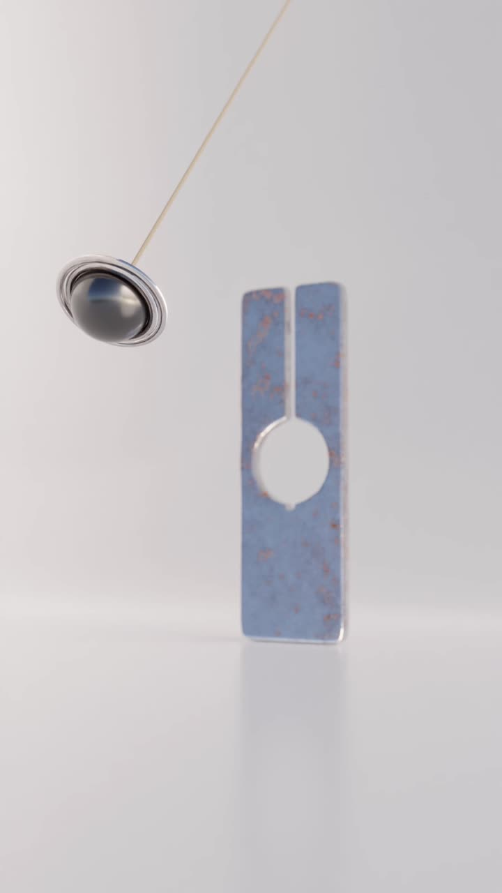 diseño geométrico metálico abstracto con péndulo