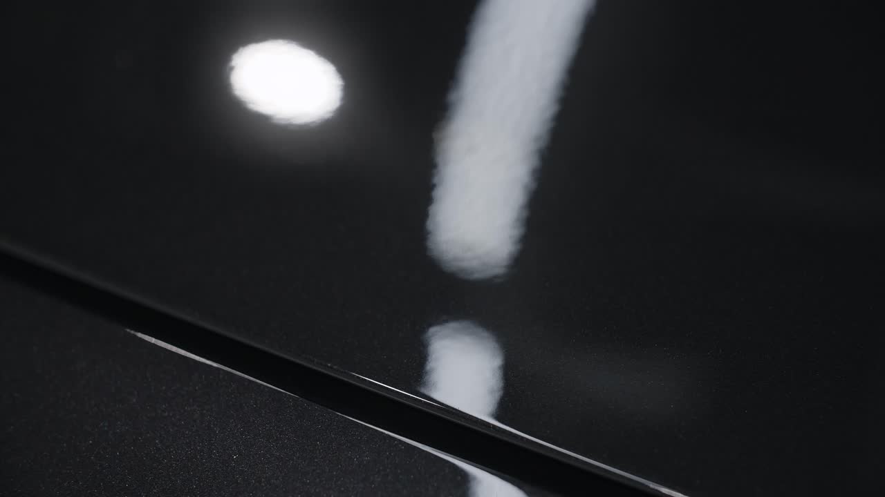 Close-up of a Black Car's Polished Paint