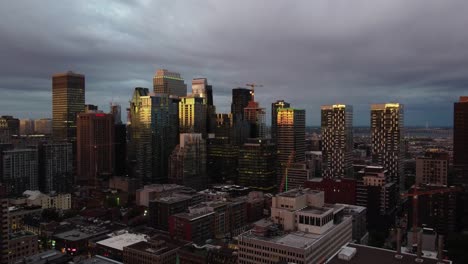 an aerial shot of city of downtown montreal, during evening, dolly out