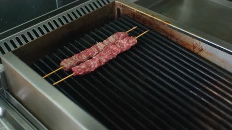 The-meat-skewer-is-placed-on-the-grill