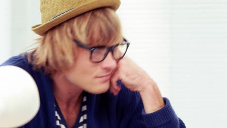 hipster businessman working at his desk