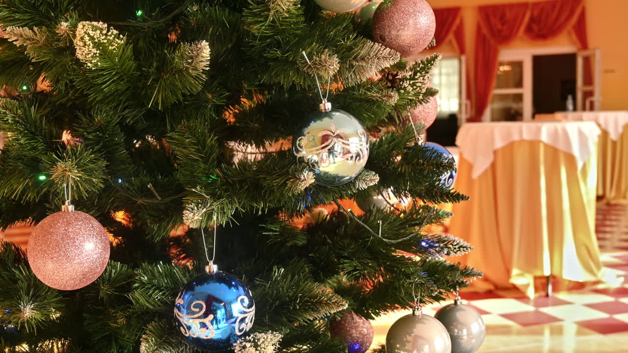 Close view of a decorated Christmas tree in a hall