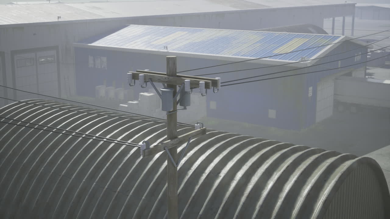 Industrial setting with power lines and metallic structures during daytime