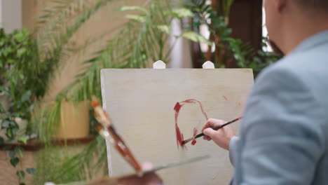 artist painting in a studio