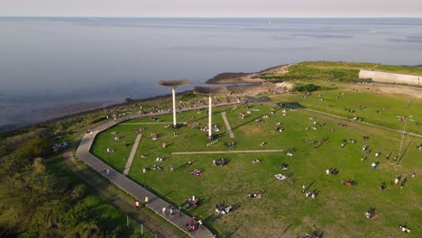 Drone-shot-circling-a-structure-in-the-Costanera-Vicente-López-Park-in-Buenos-Aires,-Argentina-during-golden-hour