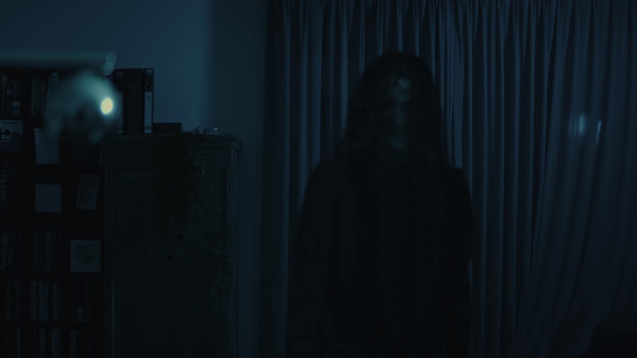 Horror scene - A ominous demon slowly walks through a living room