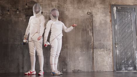 two fencers in action