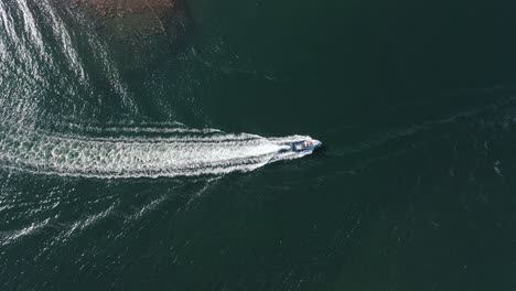 aerial view of boat coming into a harbour at inishgort, clew bay, on the west coast of ireland