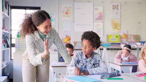 Teacher-woman,-high-five-boy