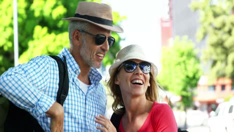 Mature-couple-is-smiling-and-pointing-something-