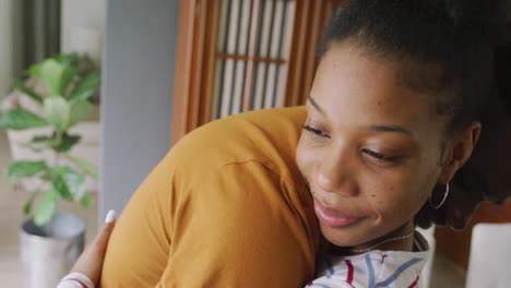 Video-of-happy-african-american-couple-embracing-at-home