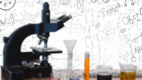 digital composition of chemicals equations and structures floating against microscope and test tubes