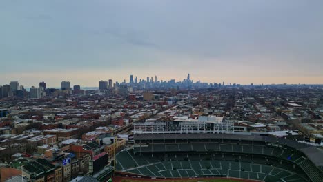 Straight-drone-shot-of-the-Chicago-Skyline-over-an-empty-preseason-Wrigley-Field