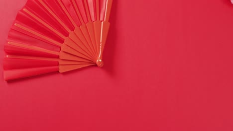 video of chinese red fan on red background