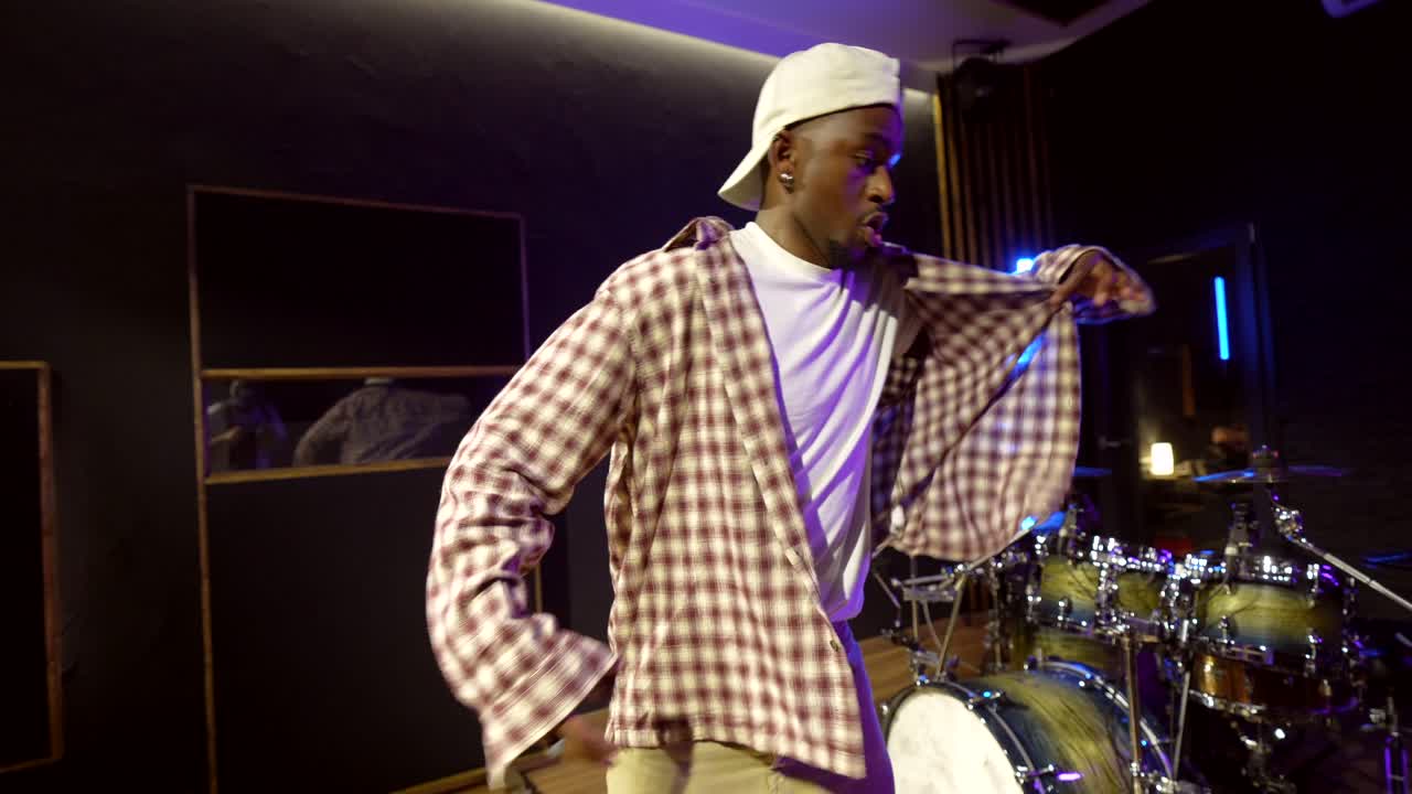 Man in music studio with drum set