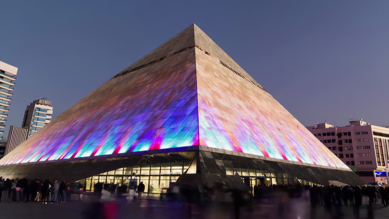 Illuminated Pyramid Building at Night