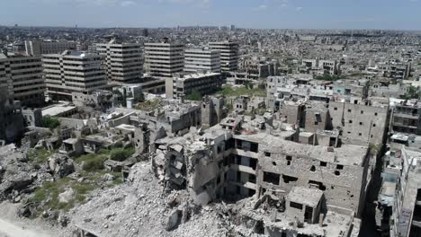 a beautiful syrian city in aerial. some of the buildings are still in ruins after the civil war 10 years ago - drone flying above the city 4k